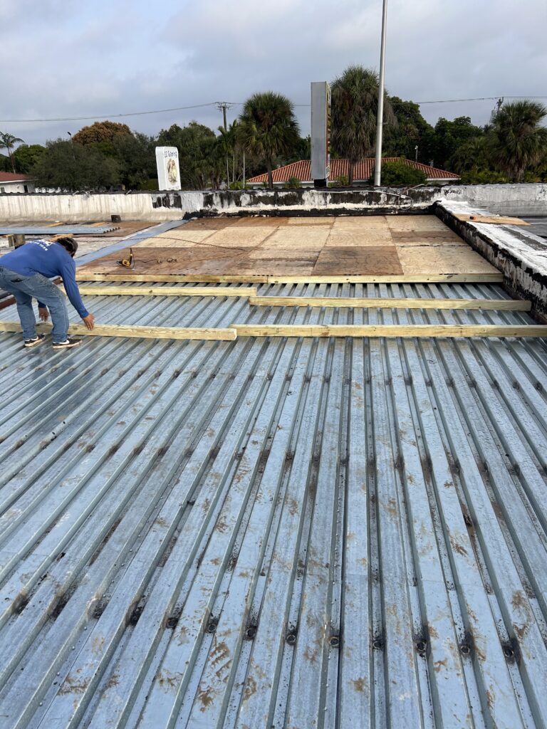 A man working on the roof of a building.